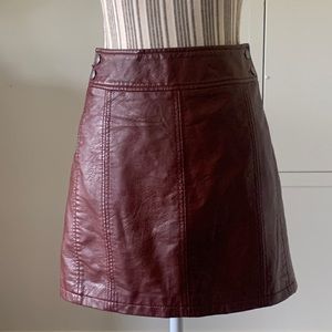 Free People Faux Burgundy mini skirt size 10